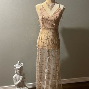 Gorgeous gold sequin dress, open shoulders and side slit..